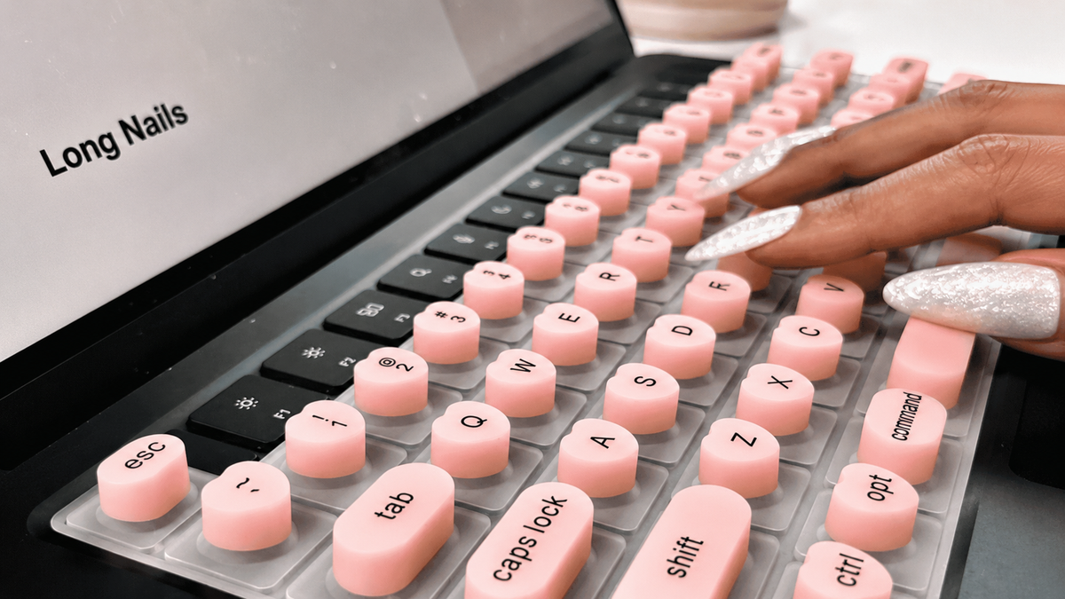 Load video: Woman with long nails typing comfortably on a Softy silicone keyboard.